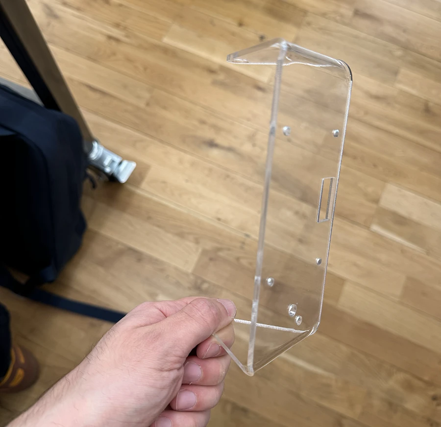 A bent piece of laser cut acrylic.