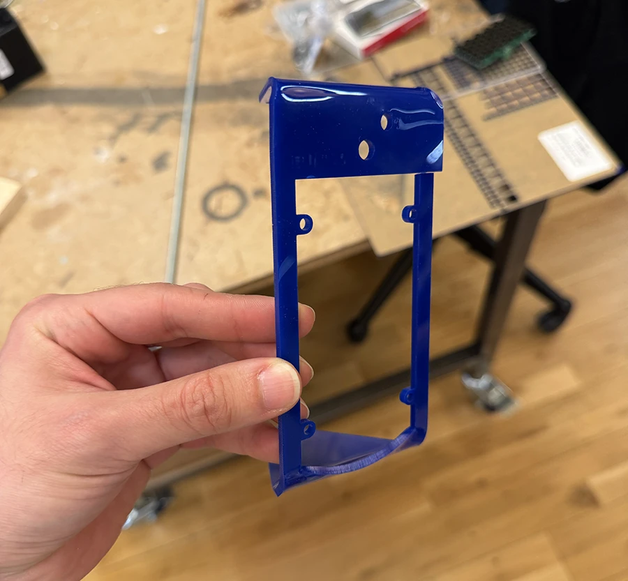 A bent piece of laser cut acrylic.