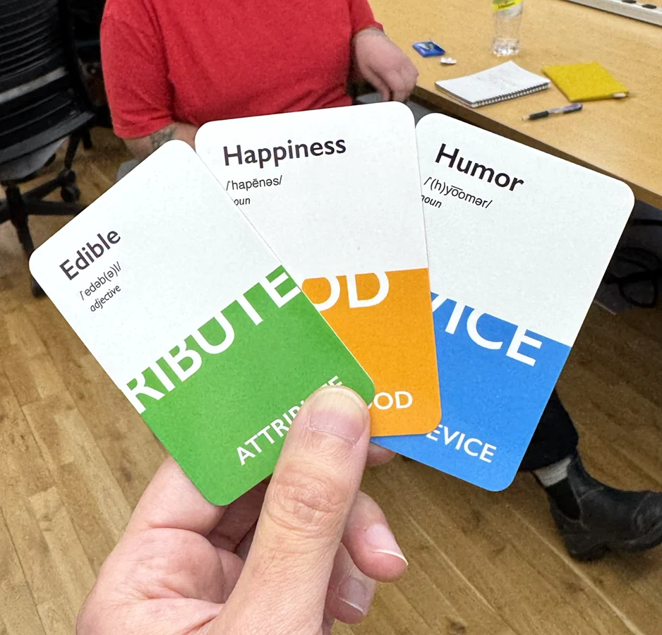 3 cards that read 'Edible', 'Happiness' and 'Humor'.