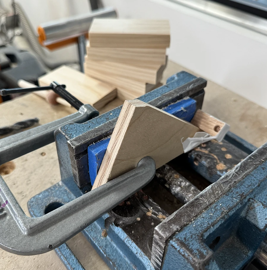Jig on a vice under a bench press.