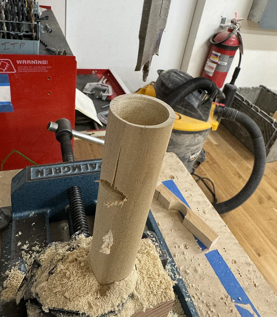 Wooden dowel with a tear in the middle.
