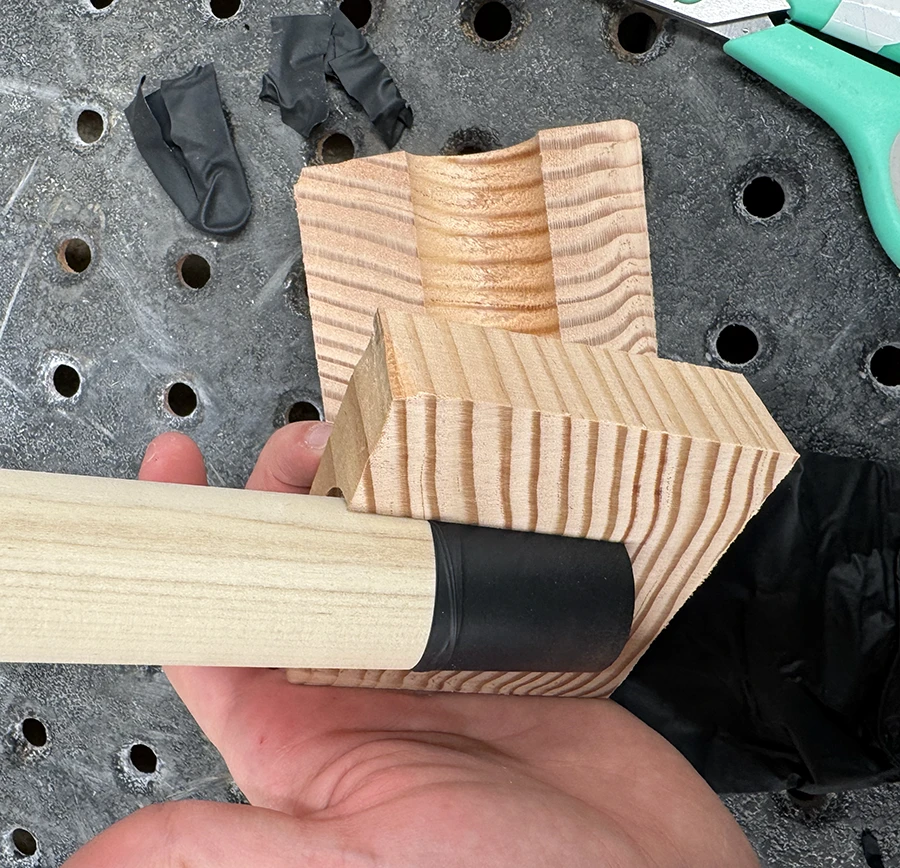 Dowel with a glove finger on the bottom.