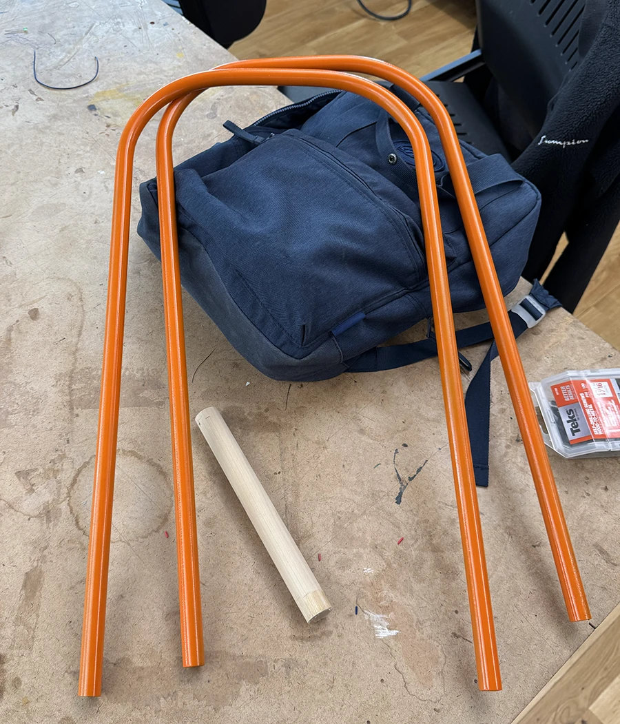 Orange metal legs on a table.