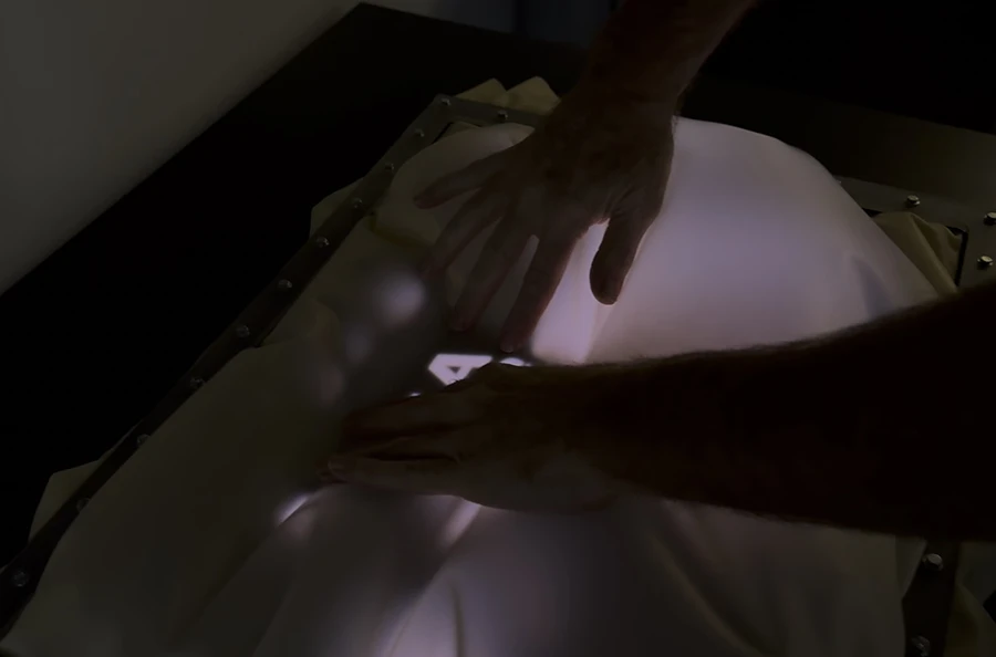 Inflated membrane is being pushed on to reveal a part of the images underneath.
