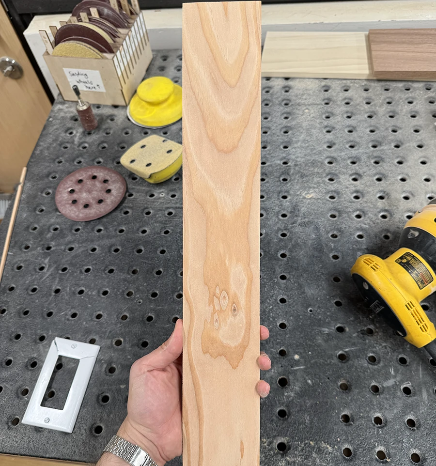 A long plank of pine wood.