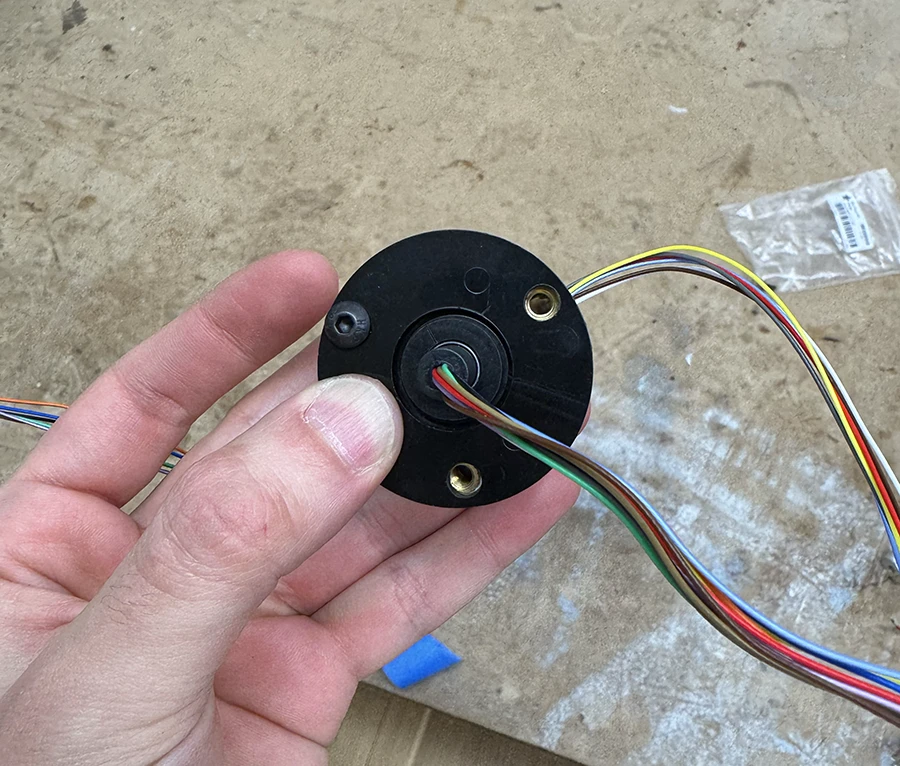 Slip ring being screwed onto something else.