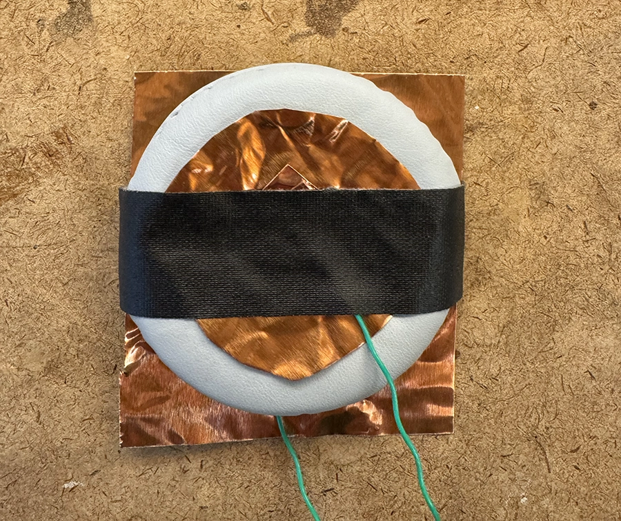 Soft switch built with two copper plates and a headphone piece foam in between.