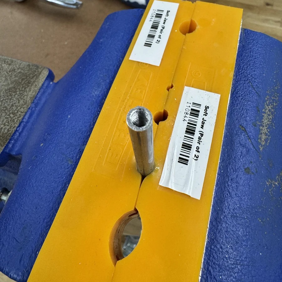 Metal tube with threads inside.