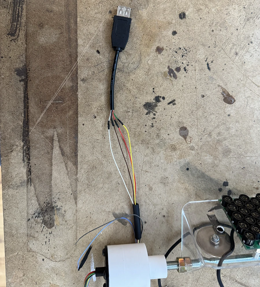 Female usb A cable soldered onto slip ring.